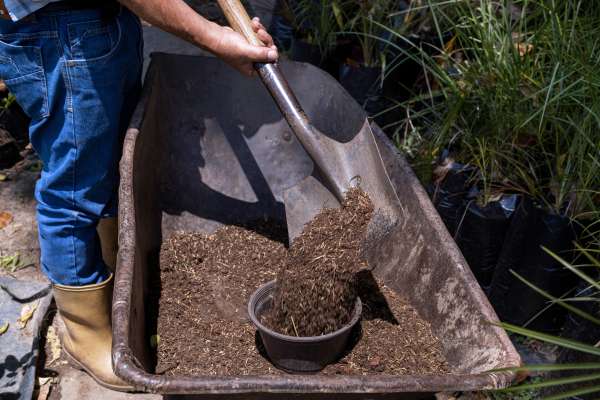 All american products being shoveled out of a wheelbarrow