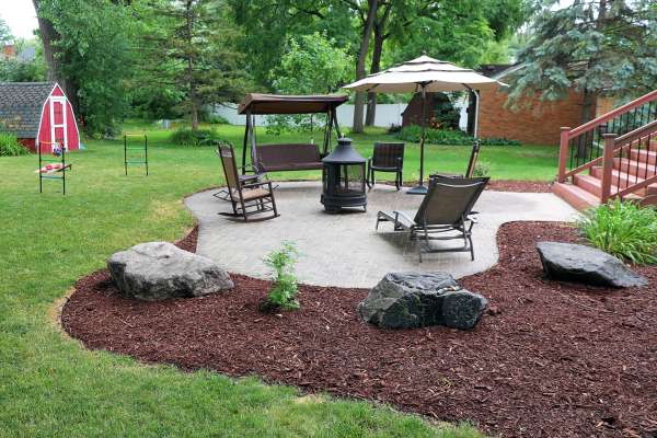 A lovely patio surrounded by gorgeous landscaping